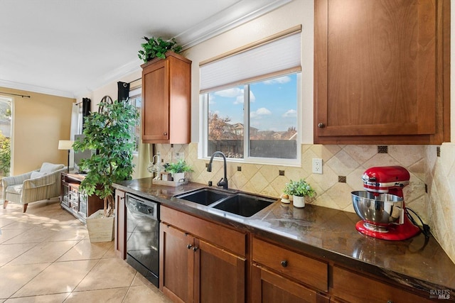 kitchen featuring sink, crown molding, light tile patterned floors, black dishwasher, and backsplash