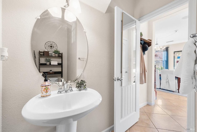 bathroom featuring sink and tile patterned flooring