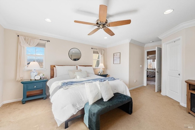 bedroom featuring ornamental molding, light carpet, and ceiling fan