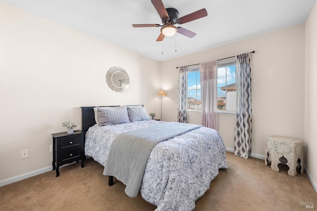 bedroom with carpet floors, baseboards, and a ceiling fan