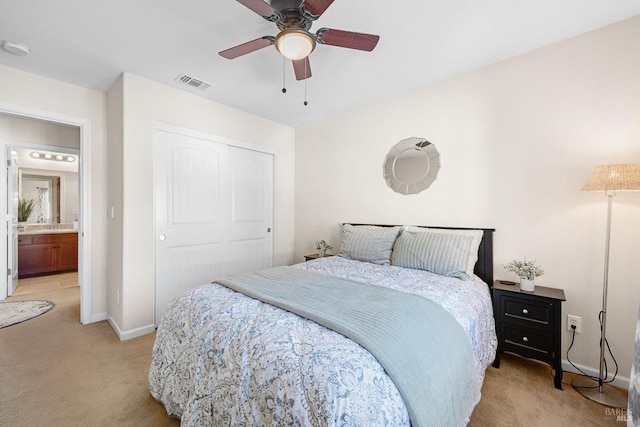 carpeted bedroom with a closet and ceiling fan