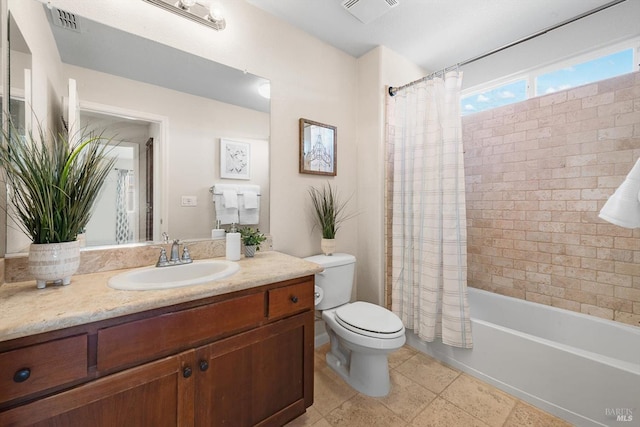 bathroom with vanity, shower / tub combo with curtain, toilet, and visible vents