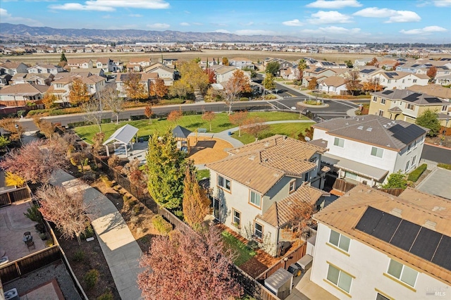 birds eye view of property with a residential view and a mountain view