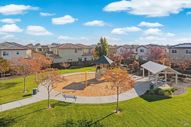 view of community with a playground, a gazebo, and a lawn