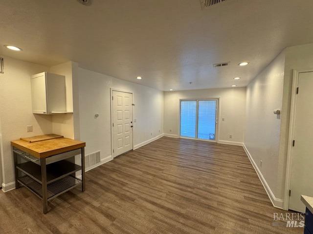 interior space with dark wood-type flooring