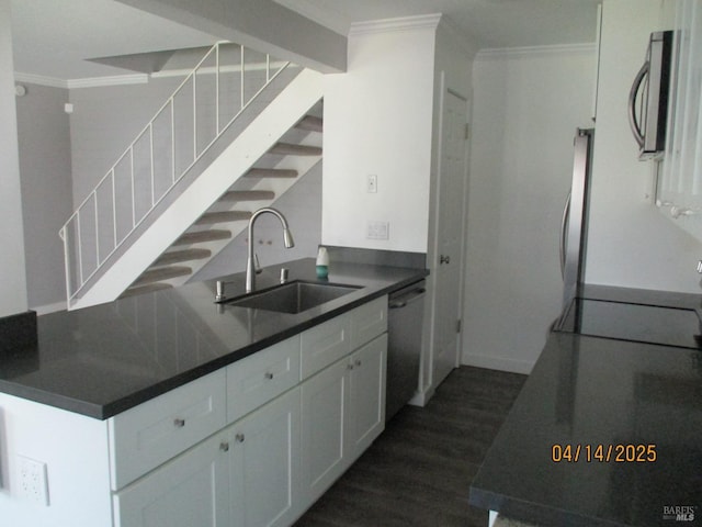 46 Tahoe Cir, Novato, CA 94947 - kitchen featuring dark countertops, appliances with stainless steel finishes, dark wood finished floors, a sink, and ornamental molding