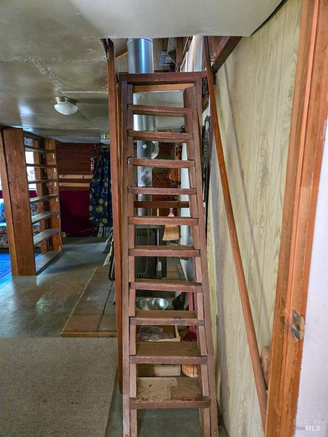 stairway with wooden walls