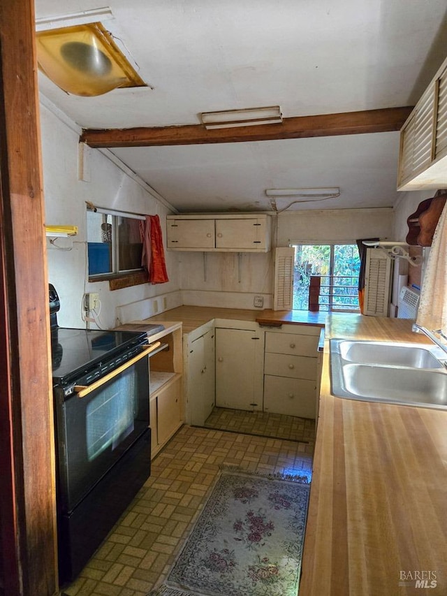 29500 Timberline Rd, Willits, CA 95490 - kitchen featuring electric range, a sink, butcher block counters, beamed ceiling, and brick patterned floors