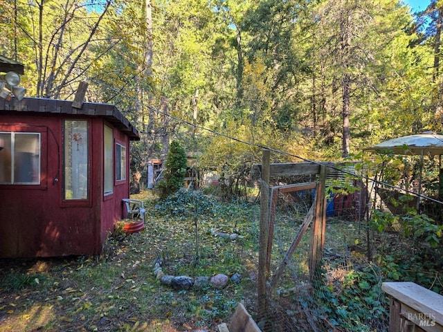 view of yard with a forest view