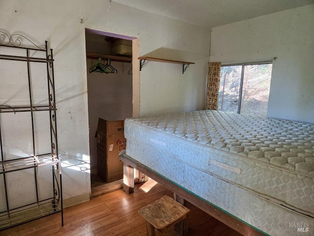 bedroom featuring wood finished floors