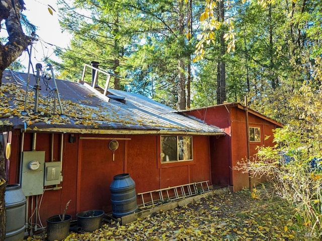 view of side of property with a standing seam roof and metal roof
