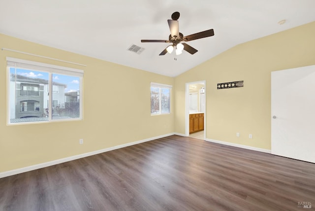 unfurnished room with hardwood / wood-style flooring, vaulted ceiling, and ceiling fan