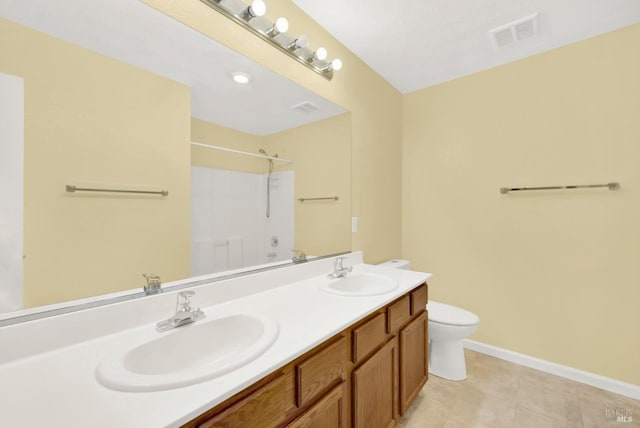 bathroom featuring walk in shower, tile patterned flooring, vanity, and toilet