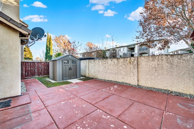 view of patio / terrace with a storage unit