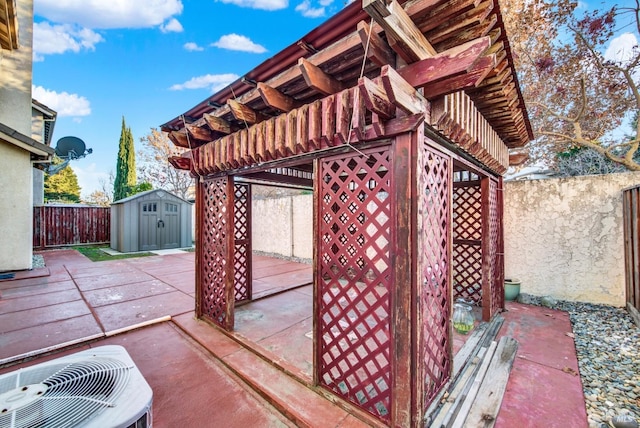 view of patio with a storage unit and central air condition unit