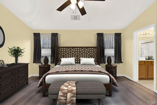 bedroom featuring ensuite bathroom, ceiling fan, wood-type flooring, and lofted ceiling