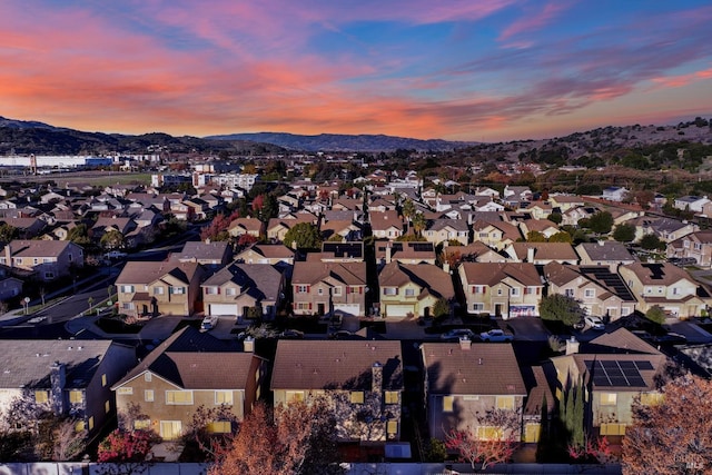 aerial view at dusk with a mountain view