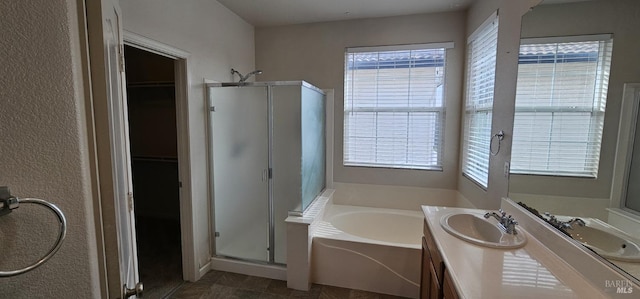 bathroom with plus walk in shower and vanity