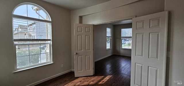 foyer entrance featuring dark hardwood / wood-style floors