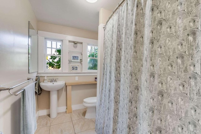 bathroom featuring tile patterned floors, sink, and toilet