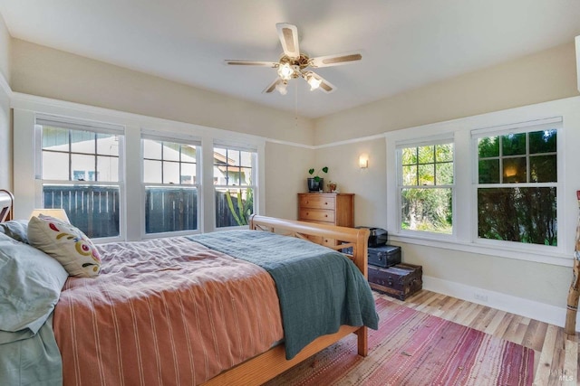 bedroom featuring ceiling fan and hardwood / wood-style floors