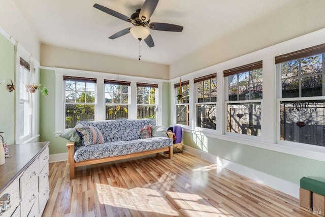 sunroom / solarium with ceiling fan and a healthy amount of sunlight