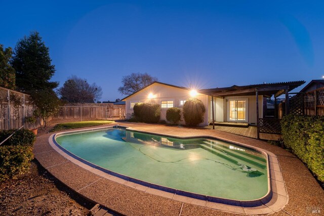 view of swimming pool featuring a lawn and a patio area