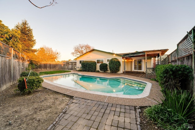 view of pool with a patio, a fenced backyard, a fenced in pool, and a pergola