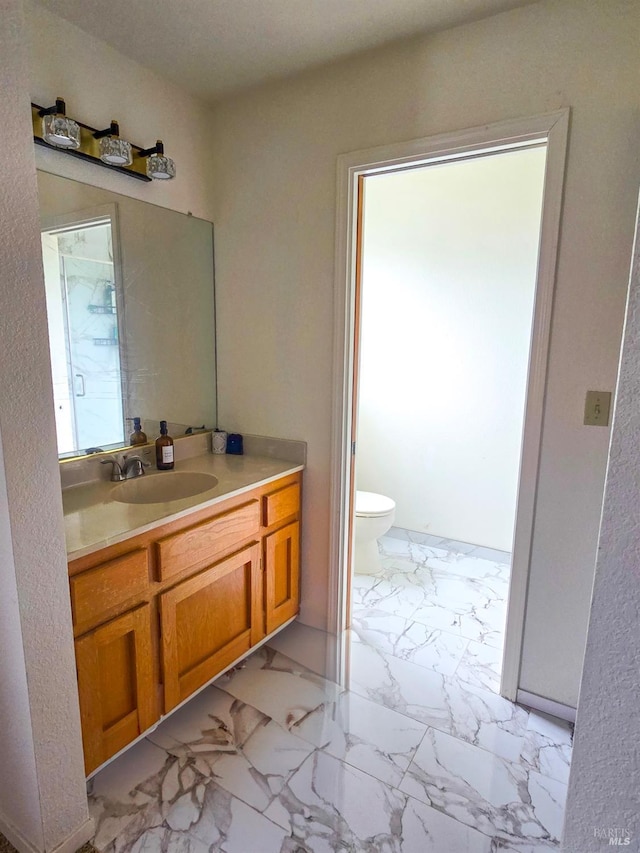 bathroom with vanity and toilet