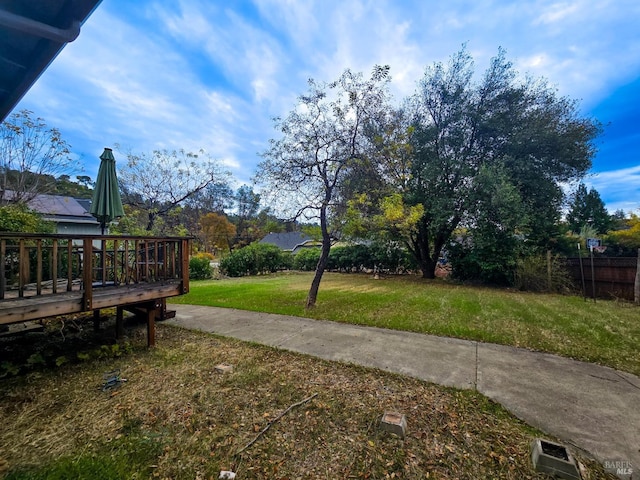 view of yard with a deck