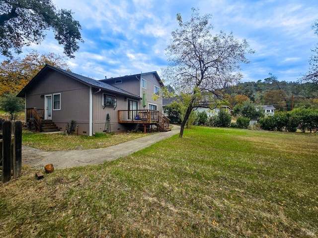 view of yard featuring a wooden deck