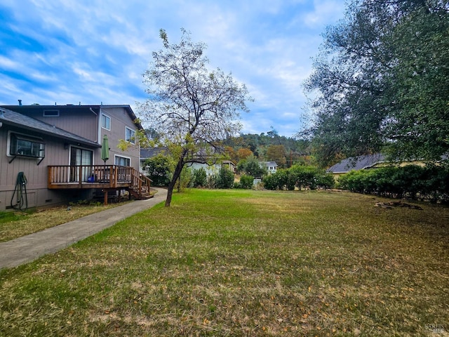 view of yard with a deck