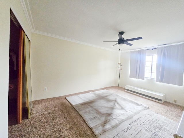 empty room featuring carpet flooring, a textured ceiling, ceiling fan, and ornamental molding