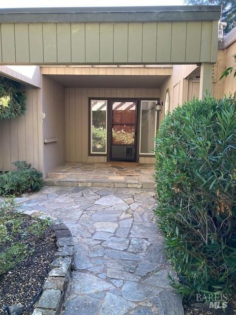 entrance to property featuring a patio area