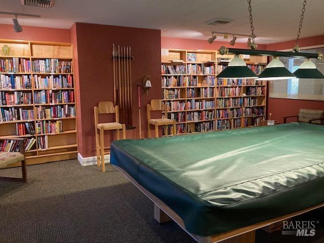 interior space featuring track lighting and billiards