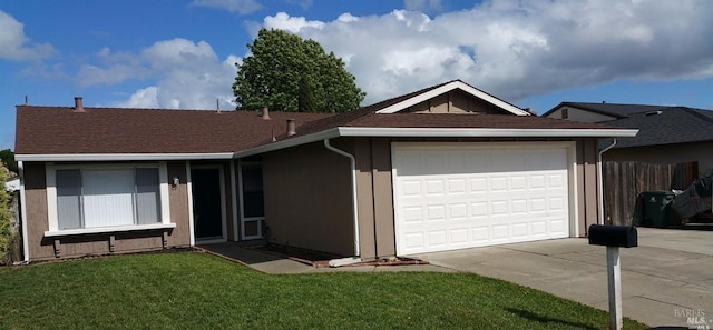 ranch-style home featuring a front lawn and a garage