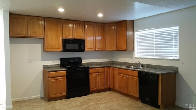 kitchen featuring black appliances and sink