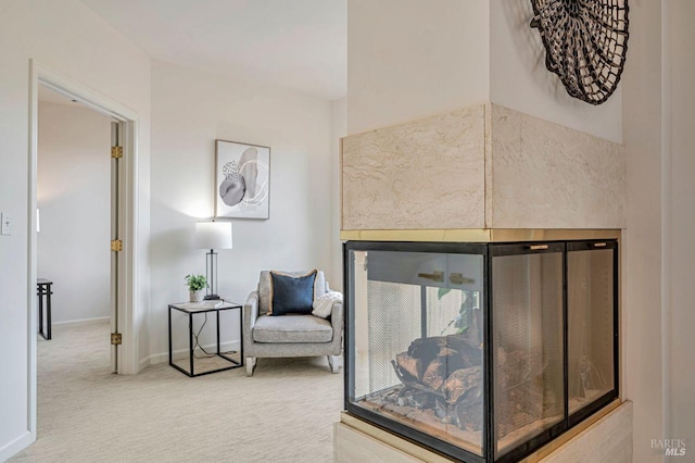 sitting room featuring carpet flooring