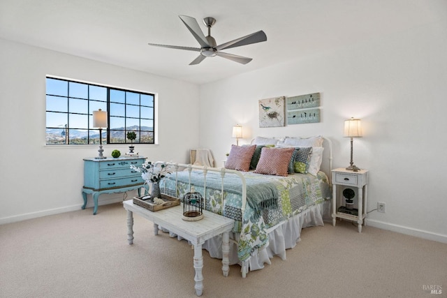 bedroom featuring ceiling fan and carpet