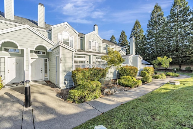 view of side of property featuring a yard