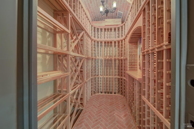 wine cellar with lofted ceiling