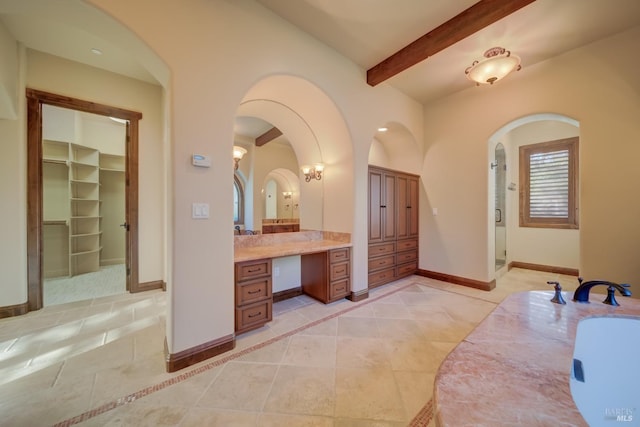 bathroom featuring beamed ceiling, vanity, and tile patterned floors