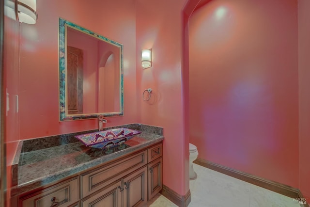 bathroom with vanity and toilet