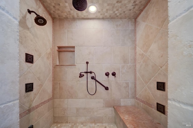 bathroom with tiled shower