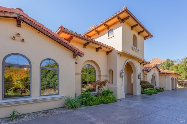 mediterranean / spanish house featuring a patio