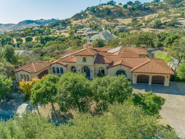 drone / aerial view featuring a mountain view