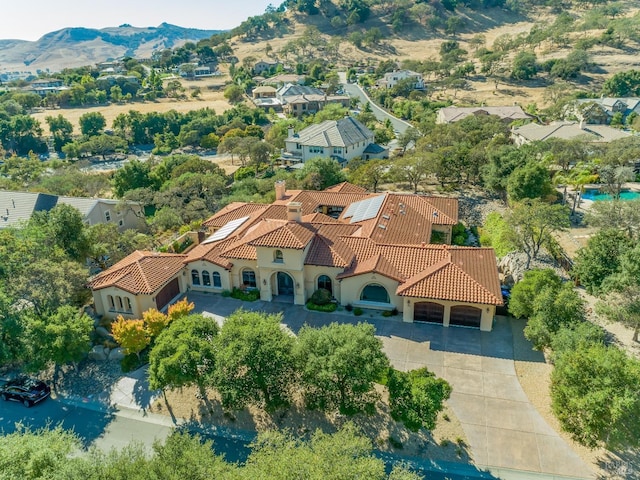 birds eye view of property with a mountain view