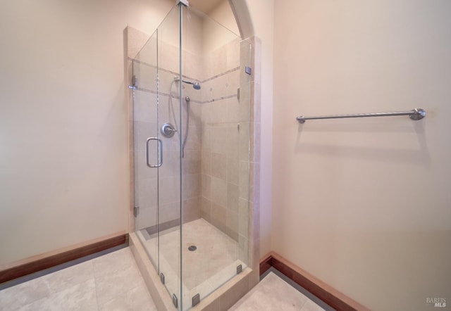 bathroom featuring tile patterned floors and walk in shower