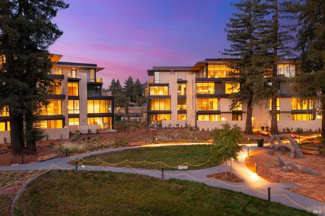 view of outdoor building at dusk