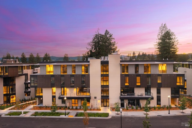 view of outdoor building at dusk